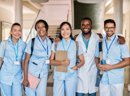 five nurse smiling together